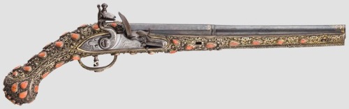 Turkish flintlock pistol mounted with gilded silver and red coral, early 19th century.from Hermann H