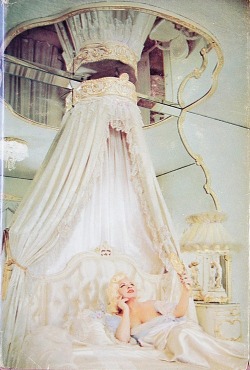 Dollpeach:  Mae West Reclines On A Typically Understated Bed On 