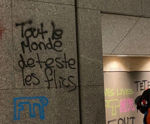 “The whole world hates the police / Fuck the police" French & German anti-cop graffit