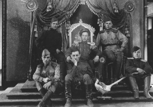 historicaltimes:Soviet soldiers sitting on the throne of emperor Pu Yi, leader of the Japanese puppe