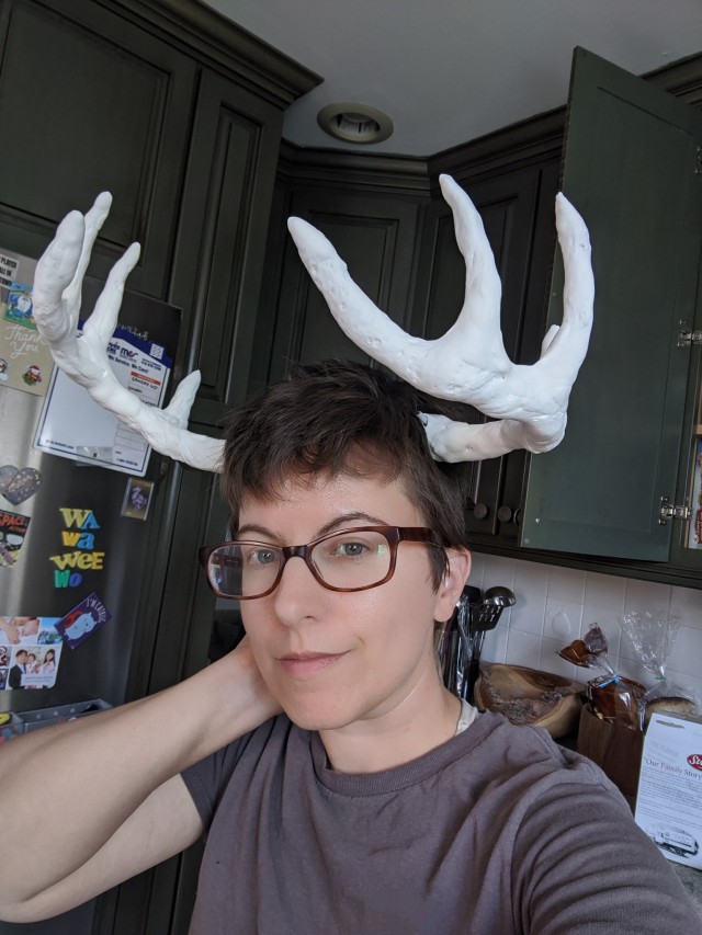 Tumblr user draconym wearing white clay antlers