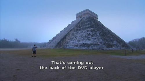 wenchyfloozymoo: Karl explaining how to play a DVD to Suzanne while at the Chichen Itza.