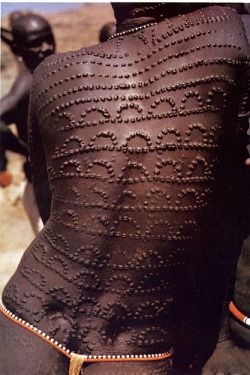 Africa | Scarification on a Nuba woman marking