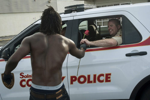 yahoonewsphotos: The peaceful side of the Ferguson protests Nightly chaos in the St. Louis suburb is