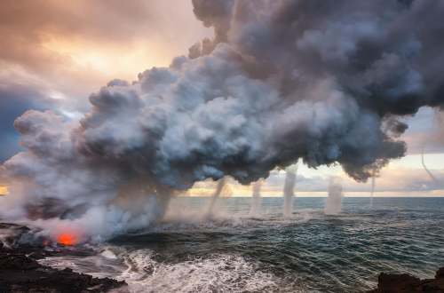 meancutie:  On an early morning shoot at the Waikupanaha ocean entry, lava from Kilauea volcano poured into the sea, creating a huge steam plume that rose with such velocity, it generated multiple vortices as it billowed upward into the sky. (x) 