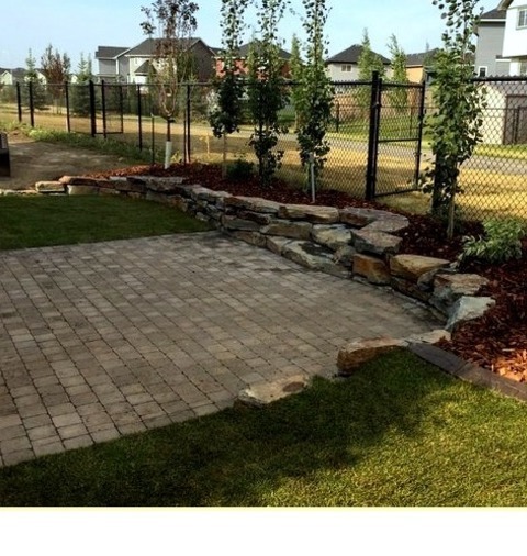 Landscape Retaining Walls Inspiration For A Medium-sized, Modern, Full-sun Backyard With A Stone Retaining