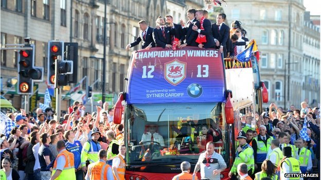 blue-madness-blue:  Cardiff City fans cheer their team on a day of sunshine celebrations