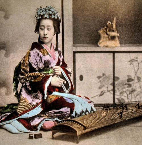 Informal portrait of woman seated beside koto.  Hand-colored photo, about 1880&rsquo;s, Jap