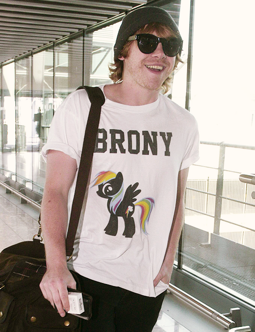 fiftyshadesen:  Rupert Grint sports a “Brony” shirt as he departs London’s Heathro