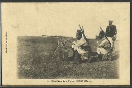 Moroccan police firing a Hotchkiss machine gun, early 20th century.