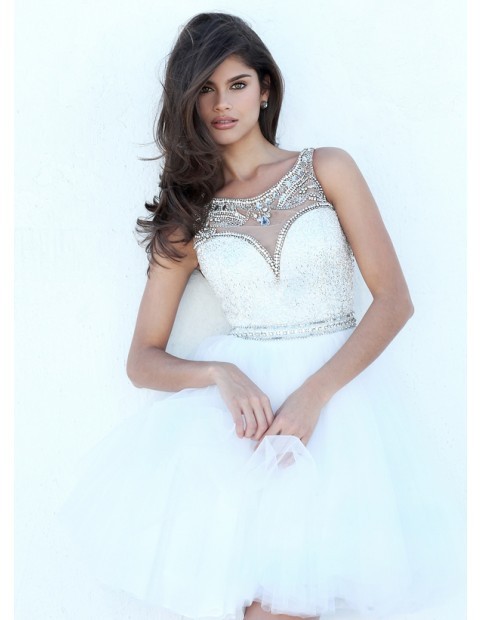 Multi-colored beading adorns the illusion scoop neckline atop the all over beaded sweetheart bodice 