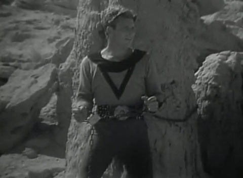 Buck Rogers (1939) E06Buck Rogers (Buster Crabbe) and Dale Arden tied to a rock.