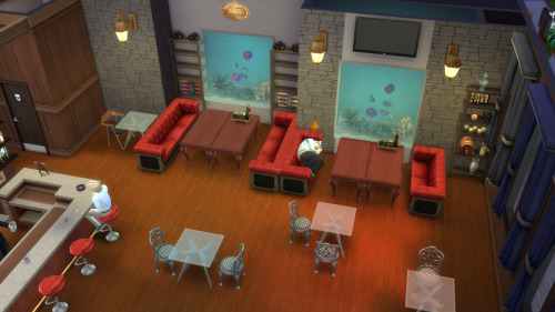 arial shot of the HOMRA bar remade in the sims 4, showing the tables, booths, and aquarium walls, with kamamoto asleep on a booth