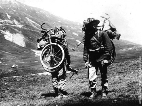 vintageeveryday: A couple of soldiers from the Italian Rifle Battalion, carrying their bicycles on t