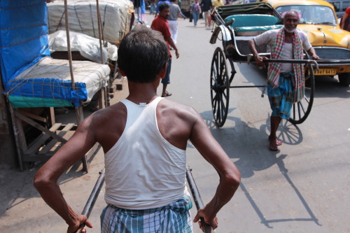 The view from behind - a pull rickshaw driver leads us through the streets of Kolkata. 