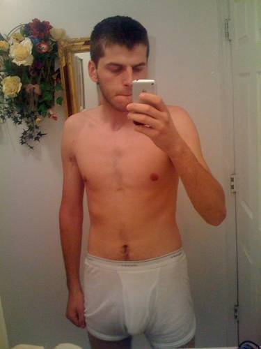 undie-fan-99:  Guy showing off in (what appears to be) his white Hanes boxerbriefs.