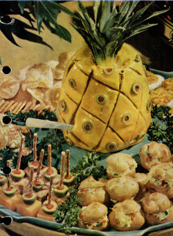 misforgotten2:  This monstrosity is worse than you imagine. I had to dig out the original source to figure  it out.  Can you guess?Answer below.This centerpiece is mashed liver sausage molded over a glass jar and coated with a mustard and mayonnaise