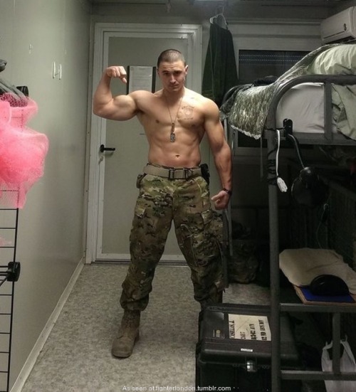 shirtless soldier showing off his muscle