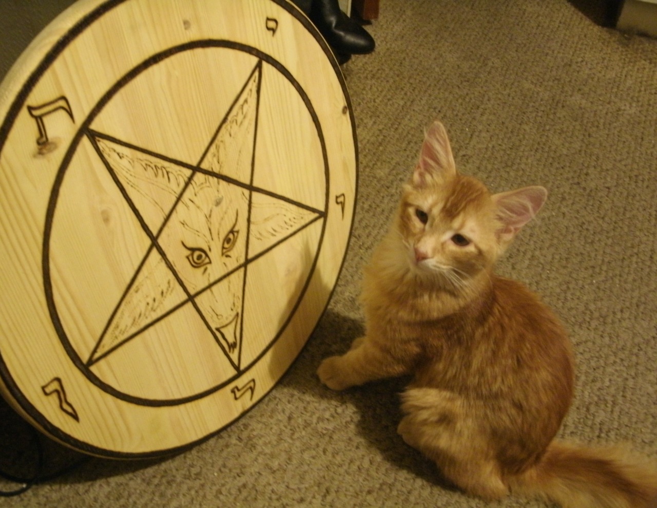 Cyrus, inspecting the progress on the burning of a new Sigil of Baphomet.
~ Witch Hydra M. Star of Infernal Ink Magazine and The Burning Witch.