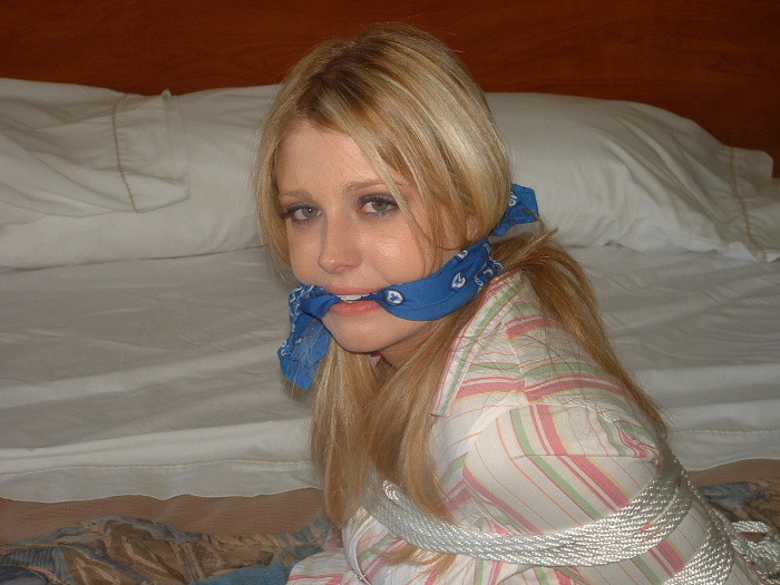 graybandanna:  Cute captive tied up in a denim skirt and a blue bandanna gag 
