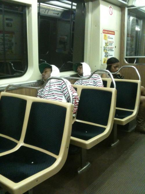  There are two identical-looking people sleeping on the subway 