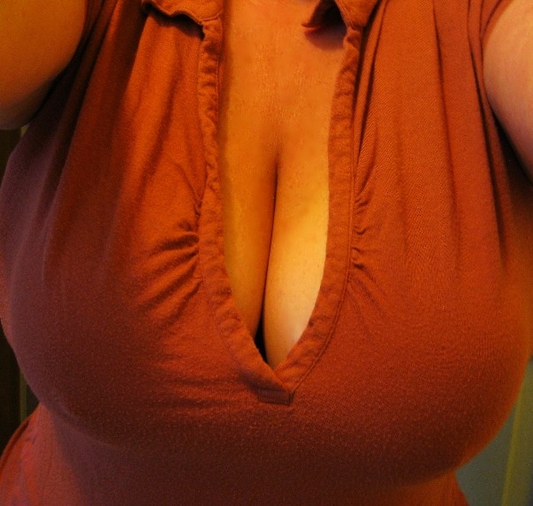 smushedbreasts:  Damn! Huge breasts smushed in a tight red top! Thanks for the submission!