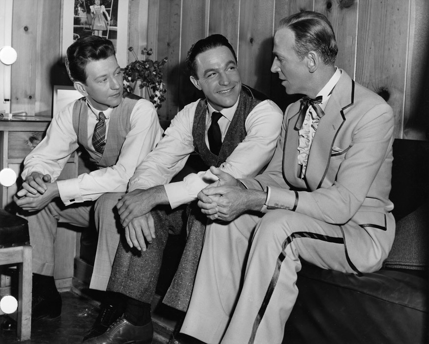 Donald O'Connor and Gene Kelly get a visit from Fred Astaire, behind the scenes on the set of Singin’ in the Rain