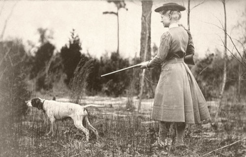 Annie Oakley hunting with dog, late 19th century.