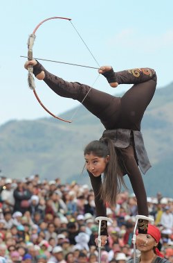 rejectedprincesses:  mccaffeteria:  rejectedprincesses:  Chynara Madinkulova (long hair) and Aida Akmatova (bun) compete in the “Traditional Archery” category at the World Nomad games in Kyrgyzstan, which concluded last week. Said games also include