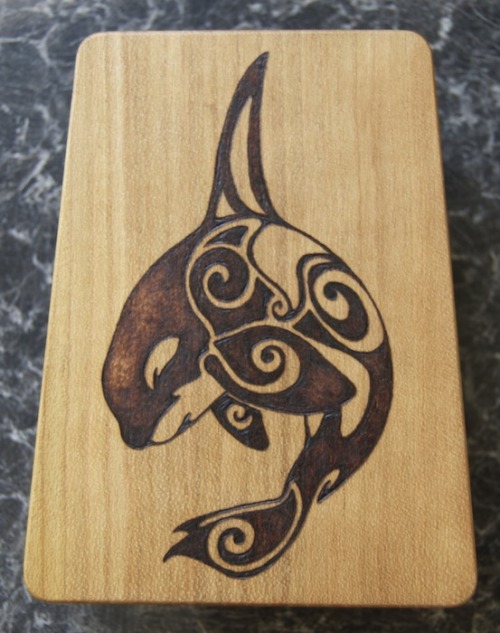 Decided to burn an orca design onto the back of my sansula. :) Might add a few more onto the front w