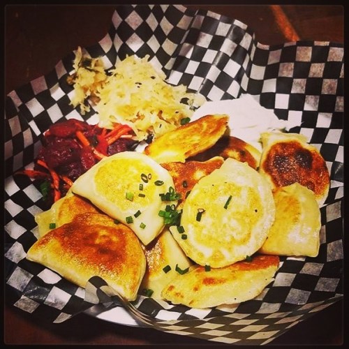 Golden fried handmade perogies served with our house made #beet salad, #sauerkraut and #dill infused