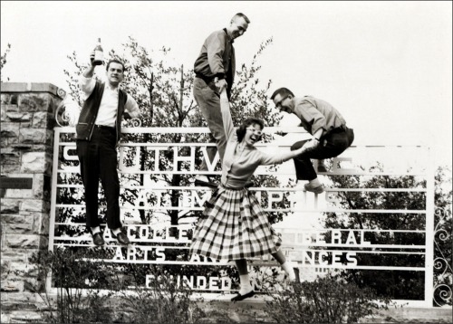 Students climbing on southwestern sign; 1961Rhodes College, Memphis TNvia