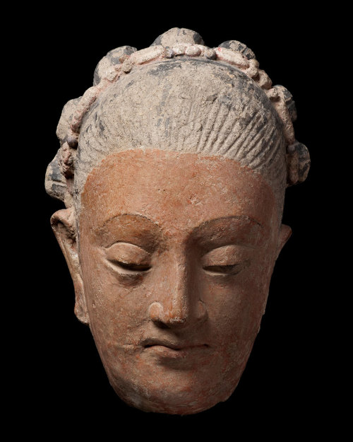 Head of a woman Greater Gandhara region4th / 5th centuryUnfired clay and pigmentHeight : 23cm (9.06&