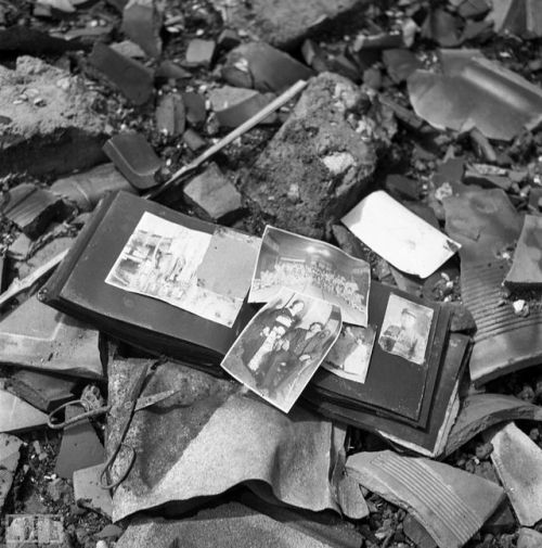 A photo album, pieces of pottery, a pair of scissors — shards of life strewn on the ground in Nagasa