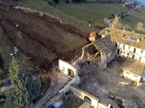 the-gas-station:  Rolling Stones Picture: Last Tuesday, a landslide in Northern Italy produced two huge boulders that barely missed a farmhouse and destroyed a nearby barn as they plowed their way downhill. © Tareom, Source 