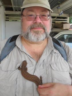 rhamphotheca:  HEY HERPERS:  I’m very jealous… Prof. Aaron Bauer of Villanova University holds a live Bornean Earless Lizard (Lanthanotus borneensis). For those of you in the Herp-know, this is one of the Holy Grails of herpetology. (via: Herpetology