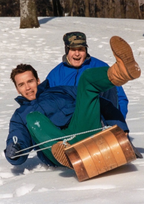 Arnold Schwarzenegger & George H. W. Bush, Sledding at Camp David, 1991.