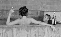 misswallflower:  Steve McQueen and his wife, Neile, take a sulphur bath at Big Sur, 1963. 