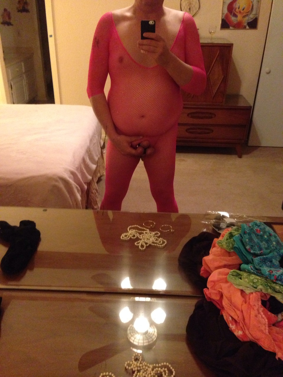 Decided on pink crotchless body suit and leather cock &amp; ball tuxedo as appropriate
