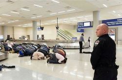 philadelphiaprintworks:  A January 29th moment of prayer at Dallas/Fort Worth baggage claim during a travel-ban protest. Photographed by Laura Buckman.