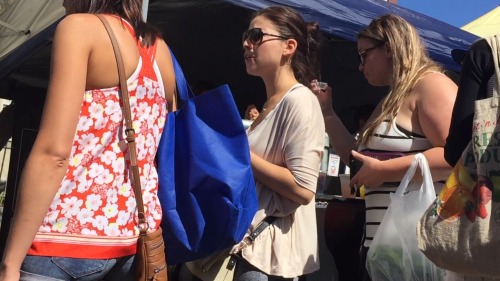 toeman969: Candid feet and face of sexy young brunette at the Farmer’s Market. Nice red toenails!