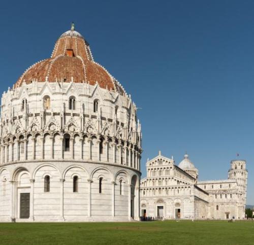 Pisa Baptistery, with the Pisa Cathedral and the Leaning Tower of Pisa in the background (Italy).