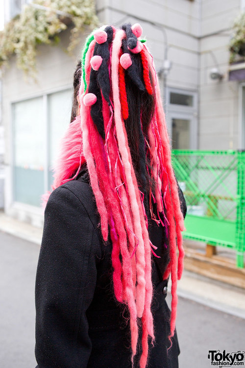 Japanese programmer Ikumi on the street in Harajuku with pink hair falls and fashion by Takuya Angel