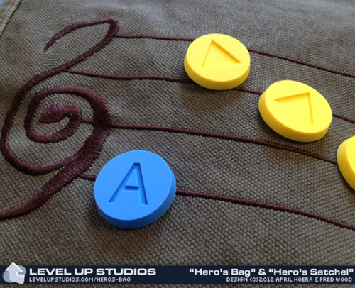 nerdsandgamersftw:  Hero’s Bag & Hero’s Satchel Messenger Bags  Features: Embroidered Hylian music score Ten note pins lets you recreate Every possible song Hero’s Bag holds full-size laptops  Via LevelUpStudiosHero’s Bag (Messenger Bag)