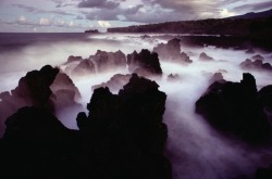 unrar:  Sea and mist swirl through an ancient lava flow - a legacy of Haleakala on Maui’s northeast coast. The volcano last erupted in 1790, Hawaii, Paul Chesley. 