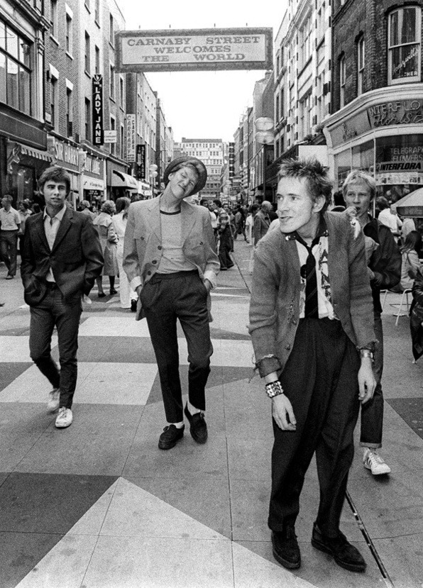 pinkfled:  The Sex Pistols walking down Carnaby Street. Photo by Jill Furmanovsky