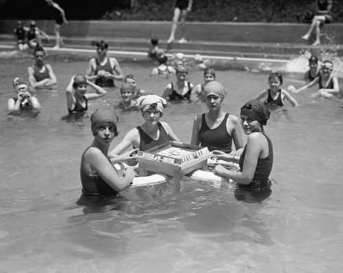 Women playing Mahjong on a floating table in a swimming pool, Washington, D.C., June 20, 1924 © Unde