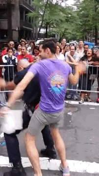 plutoh:  buzzfeed:  A Hot Cop Got Down At NY PrideThe purple-shirted dancer, Aaron