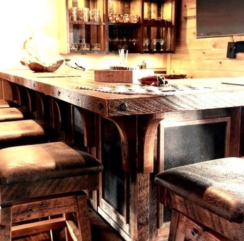 L-Shape - Rustic Home BarInspiration For A Large Rustic L-shaped Dark Wood Floor Seated Home Bar Remodel