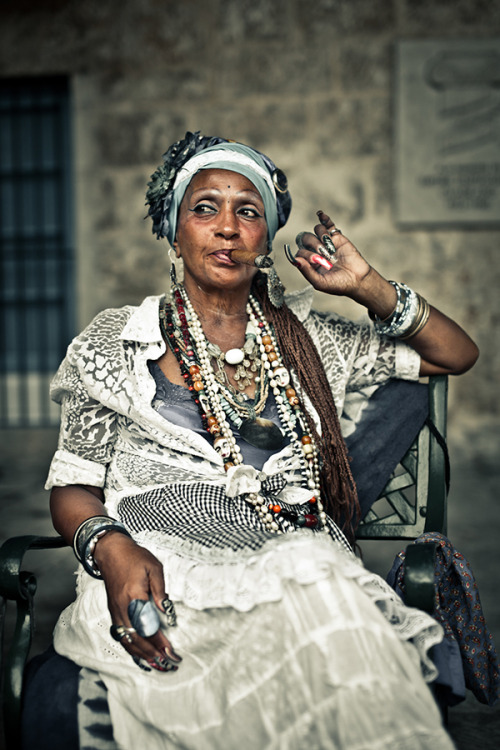 openupnsay-ra:  stage9:  barringtonsmiles:  cubanas/santeras with their cigars looking like the queens they are.   so this is my grandma omg  That’s some bawse shot… 